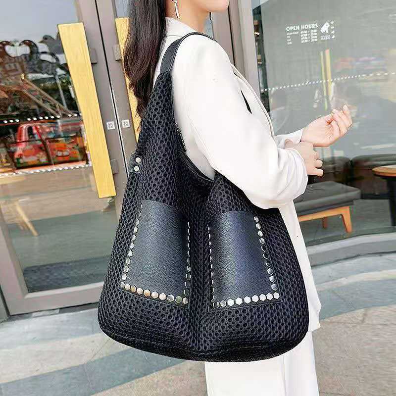 Women Bags Manufacturer - ボルトカジュアルでおしゃれなユニークなレディースバッグ、柔らかい革素材、パッチワークデザイン、大容量、シングルショルダー、アンダーアームバッグ